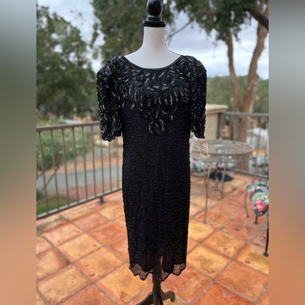 Beautiful silk vintage beaded and sequined dress. Small flaws pictured.